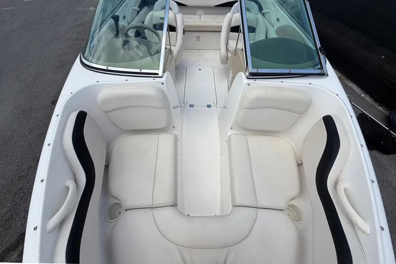 Slide: The Image of Interior view of a 2003 Chaparral 183 SS boat with white seats and black accents. - 40
