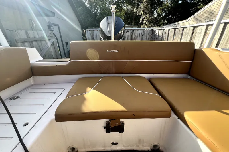 Slide: The Image of 2019 Glastron GTD 220 boat interior with tan seating and white accents. - 51