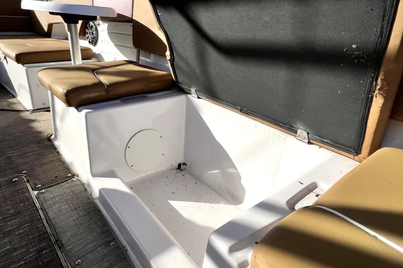 Slide: The Image of 2019 Glastron GTD 220 boat interior with tan seating and storage area. - 53