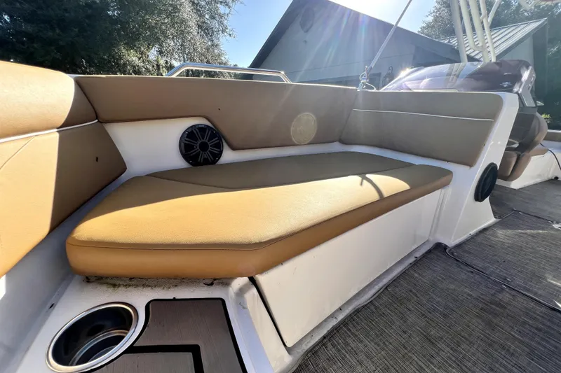 Slide: The Image of 2019 Glastron GTD 220 boat interior with tan seating and speaker system. - 47