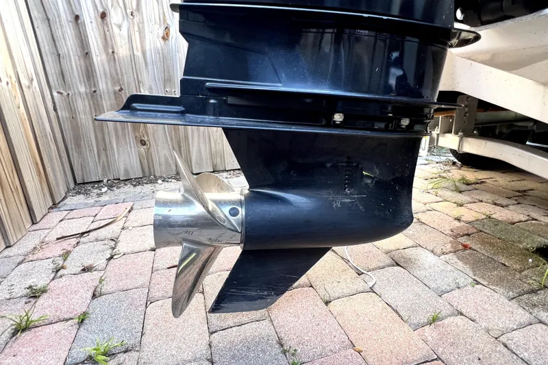 Slide: The Image of 2019 Glastron GTD 220 boat propeller on brick pavement background. - 22