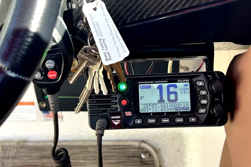 Slide: The Image of Control panel of a 2019 Glastron GTD 220 boat with radio and keys. - 32