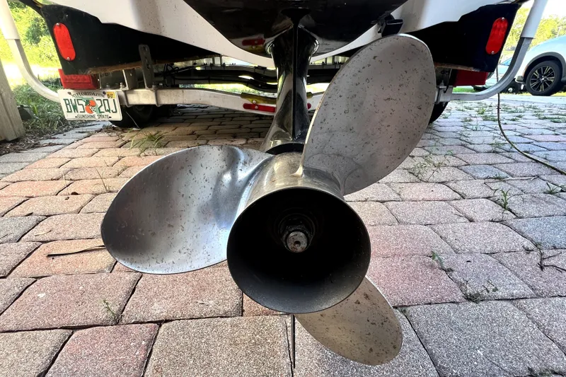 Slide: The Image of Propeller of a 2019 Glastron GTD 220 boat on a brick driveway. - 19