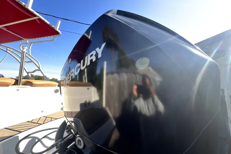 Slide: The Image of 2019 Glastron GTD 220 boat with Mercury outboard motor, sunny day reflection. - 15