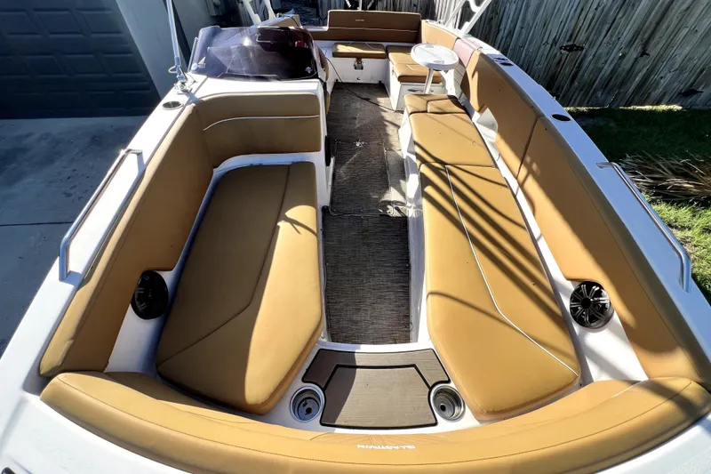 Slide: The Image of 2019 Glastron GTD 220 boat interior with tan seating and spacious layout. - 57