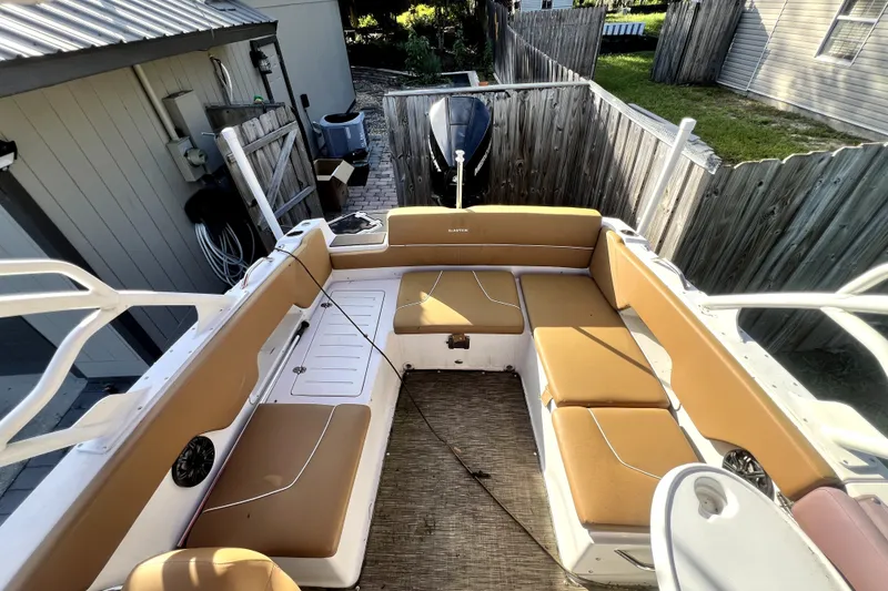 Slide: The Image of 2019 Glastron GTD 220 boat interior with tan seating and spacious layout. - 37