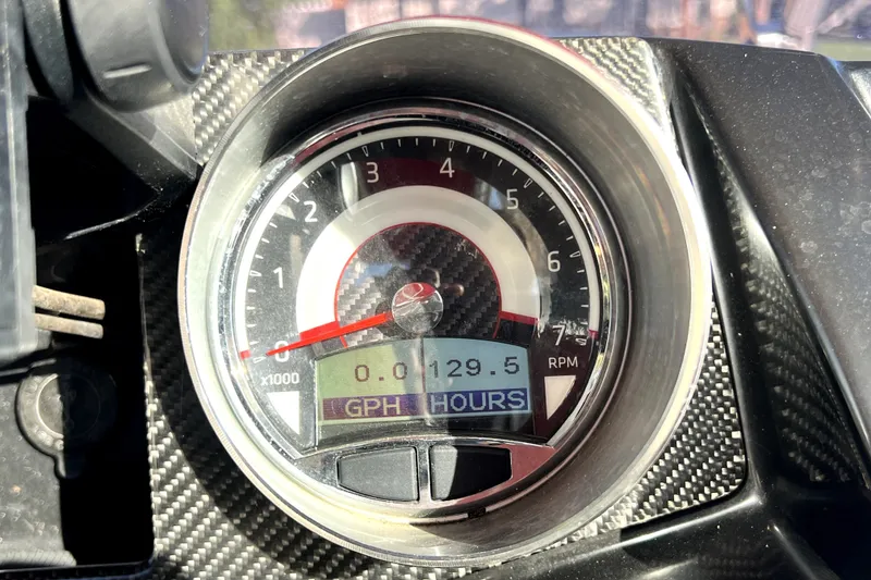 Slide: The Image of Close-up of 2019 Glastron GTD 220 tachometer displaying RPM and engine hours. - 33