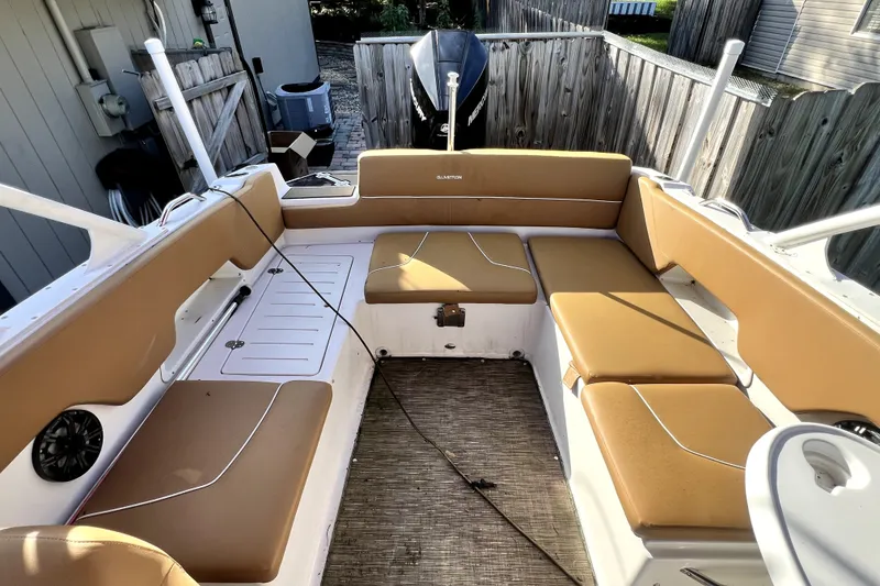 Slide: The Image of 2019 Glastron GTD 220 boat interior with tan seating and spacious layout. - 50