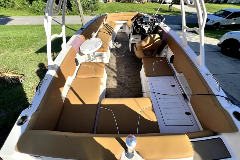 Slide: The Image of 2019 Glastron GTD 220 boat interior with tan seating and steering console. - 64