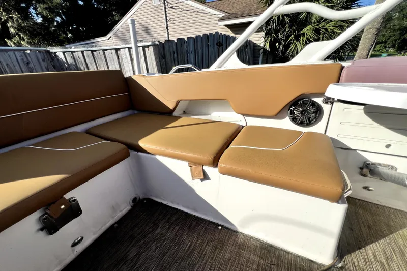 Slide: The Image of 2019 Glastron GTD 220 boat interior with tan seating and speaker. - 38