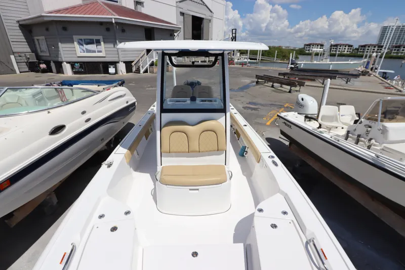 Slide: The Image of 2022 Sportsman Masters 247 Bay Boat docked, showcasing spacious seating and sleek design. - 30
