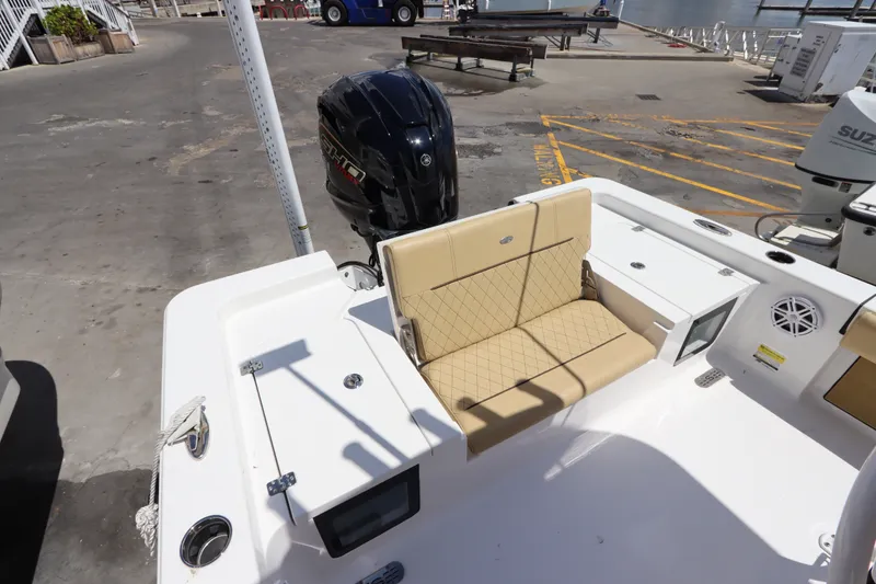 Slide: The Image of 2022 Sportsman Masters 247 Bay Boat with tan seating and Yamaha outboard motor. - 12