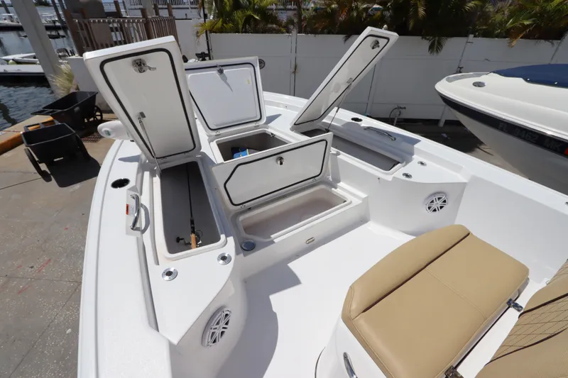 Slide: The Image of 2022 Sportsman Masters 247 Bay Boat with open storage compartments and seating. - 27