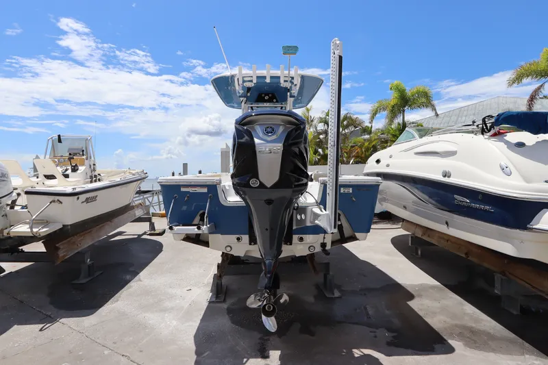 Slide: The Image of 2022 Sportsman Masters 247 Bay Boat on display under a clear blue sky. - 4