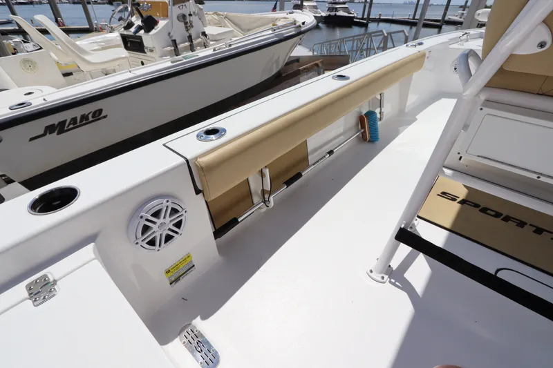 Slide: The Image of 2022 Sportsman Masters 247 Bay Boat interior with seating and storage features. - 14