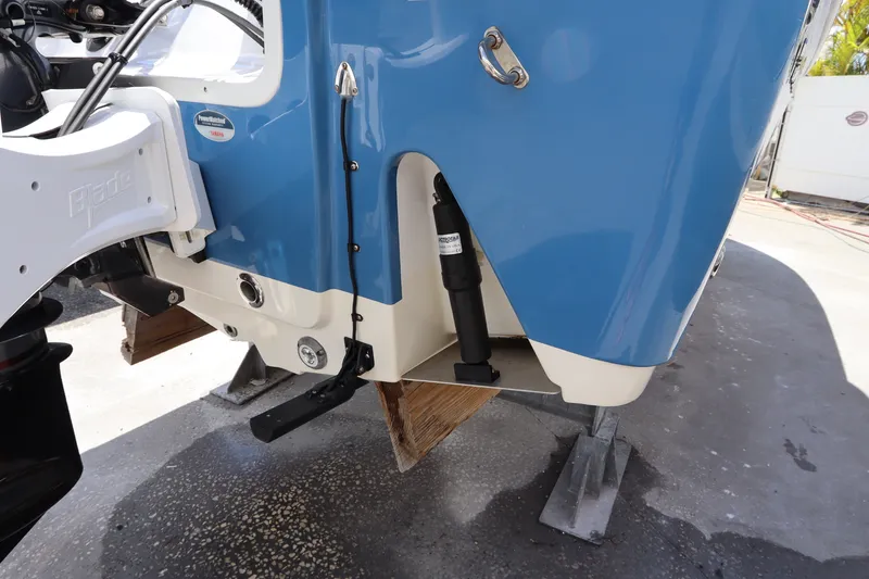 Slide: The Image of 2022 Sportsman Masters 247 Bay Boat rear view, showcasing blue hull and motor mount. - 5