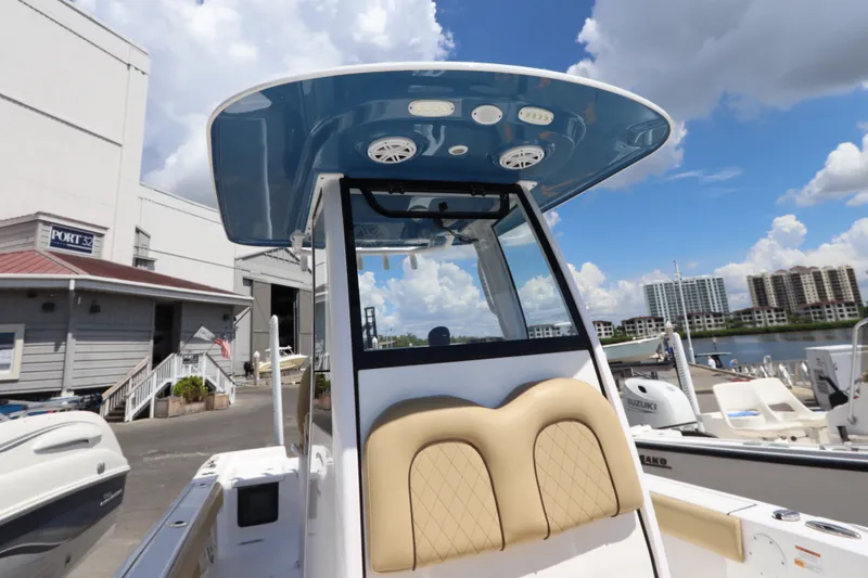 Slide: The Image of 2022 Sportsman Masters 247 Bay Boat at marina, featuring sleek design and modern amenities. - 32