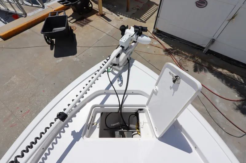 Slide: The Image of 2022 Sportsman Masters 247 Bay Boat with open hatch and mounted equipment. - 29