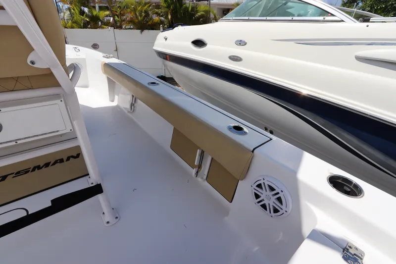 Slide: The Image of 2022 Sportsman Masters 247 Bay Boat interior with seating and cup holders. - 15