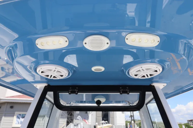 Slide: The Image of 2022 Sportsman Masters 247 Bay Boat T-top with speakers and LED lights. - 33