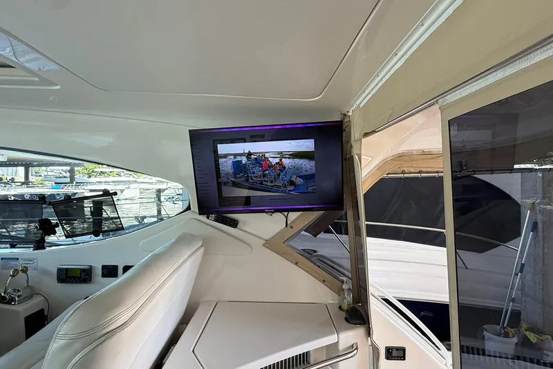 Slide: The Image of Interior of 2011 Tiara Yachts 4500 Sovran with mounted TV and helm station. - 30