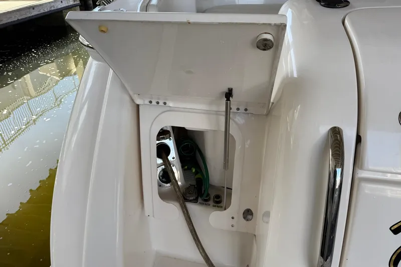 Slide: The Image of 2011 Tiara Yachts 4500 Sovran water hookup compartment, open and accessible. - 22