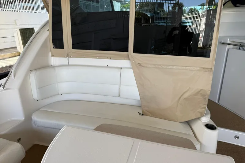 Slide: The Image of Interior seating area of 2011 Tiara Yachts 4500 Sovran with beige and white upholstery. - 28