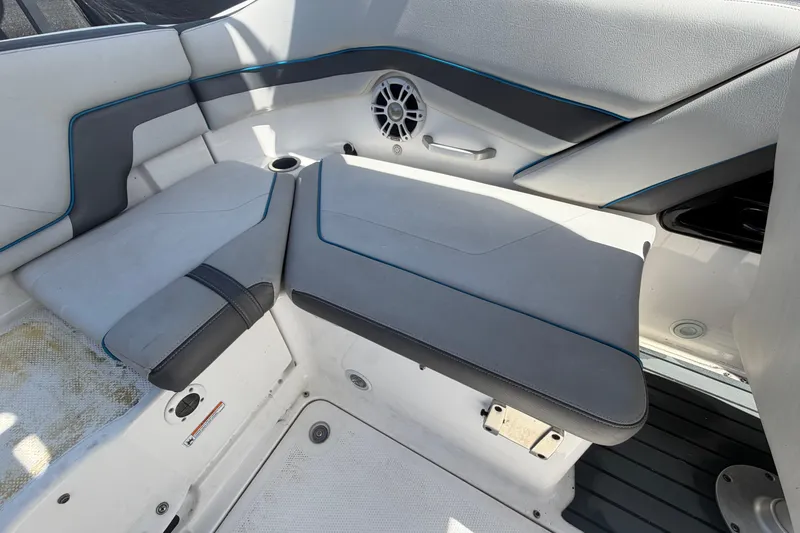 Slide: The Image of 2020 Yamaha Boats AR240 interior seating with sleek design and integrated speaker system. - 57