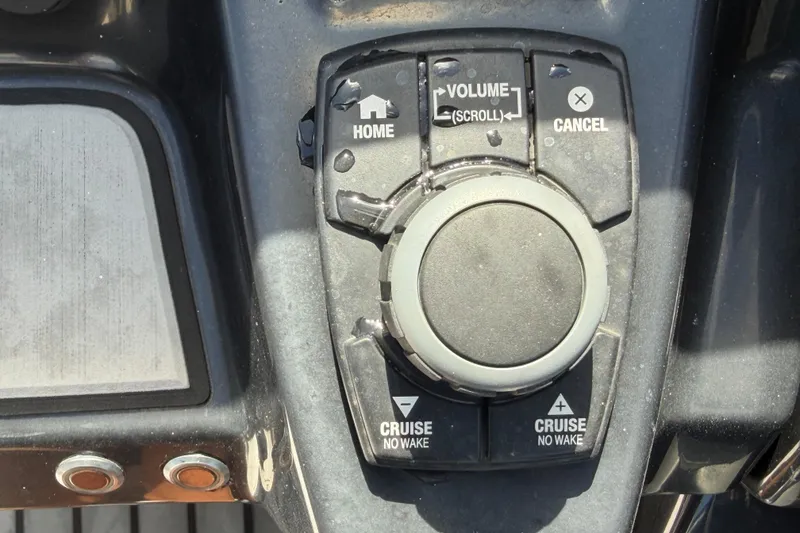 Slide: The Image of Control panel of a 2020 Yamaha Boats AR240, featuring navigation and cruise buttons. - 23