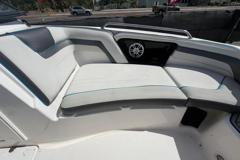 Slide: The Image of 2020 Yamaha AR240 boat interior with cushioned seating and speaker system. - 33