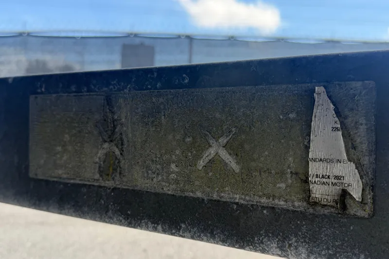 Slide: The Image of Weathered label on a 2020 Yamaha Boats AR240, partially peeling and faded. - 68