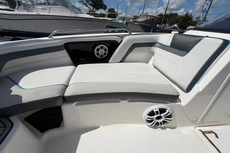Slide: The Image of 2020 Yamaha Boats AR240 interior seating with speakers, showcasing modern design and comfort. - 37