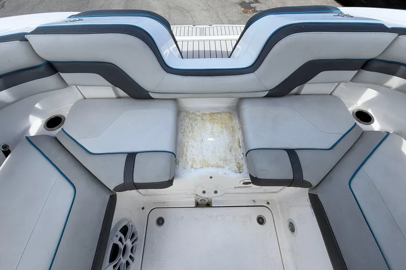 Slide: The Image of 2020 Yamaha Boats AR240 interior seating with gray and blue upholstery. - 54