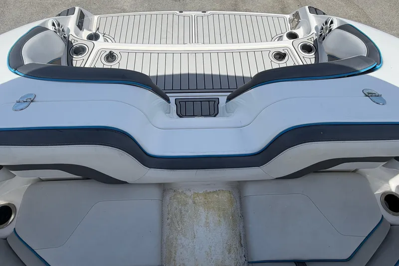 Slide: The Image of 2020 Yamaha AR240 boat interior with sleek seating and cup holders. - 62