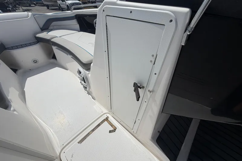 Slide: The Image of 2020 Yamaha Boats AR240 interior with seating and storage compartment. - 30