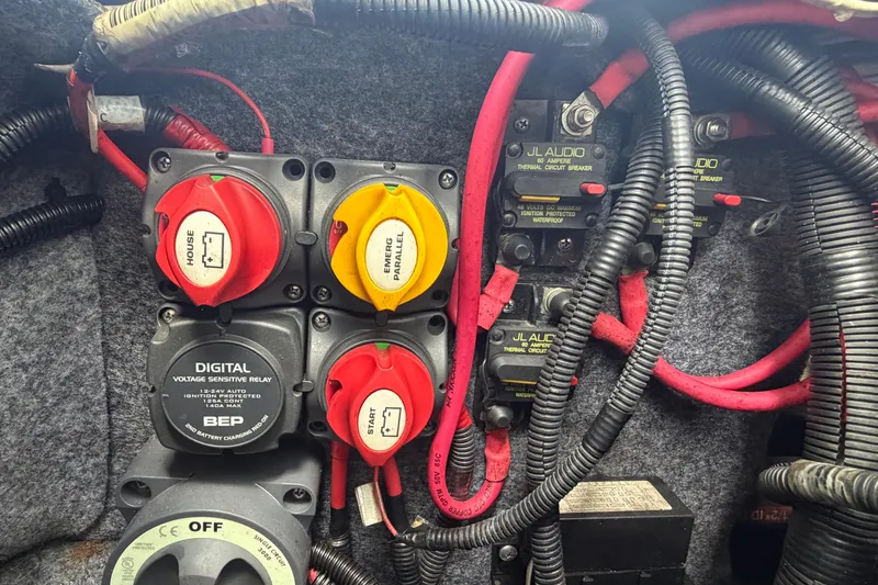 Slide: The Image of Electrical panel of a 2020 Yamaha Boats AR240 with circuit breakers and wiring. - 60