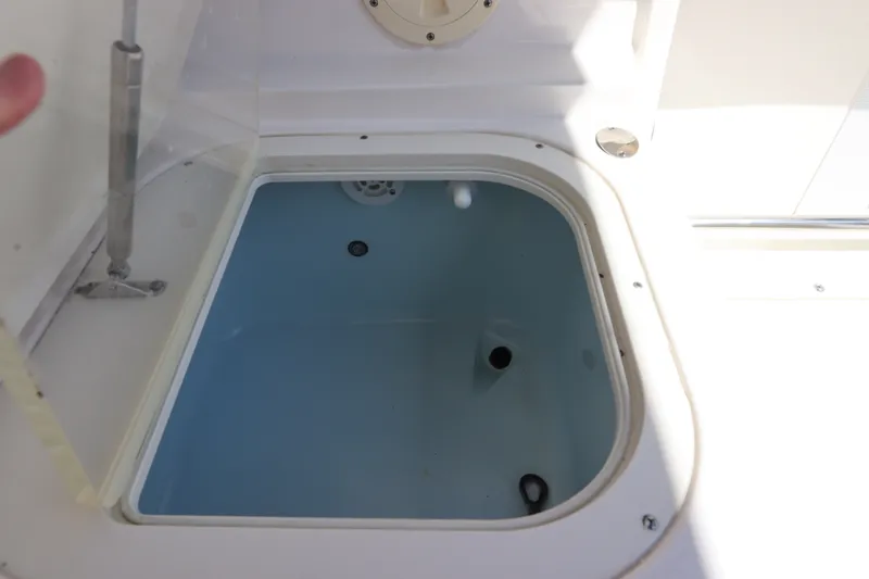 Slide: The Image of Livewell compartment on a 2021 Robalo R227 Dual Console boat. - 17