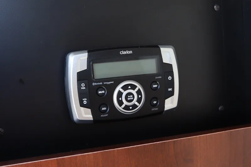 Slide: The Image of Clarion audio system in 2021 Robalo R227 Dual Console boat dashboard. - 15