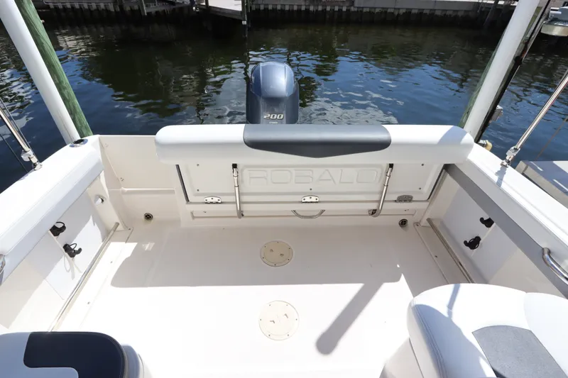 Slide: The Image of 2021 Robalo R227 Dual Console boat interior with Yamaha 200 engine. - 8