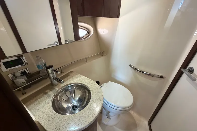 Slide: The Image of Luxurious bathroom in 2010 Sea Ray 390 Sedan Bridge yacht, featuring modern fixtures and elegant design. - 119