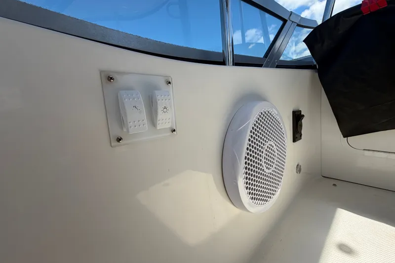 Slide: The Image of Interior of 2010 Sea Ray 390 Sedan Bridge with speaker and control switches. - 31