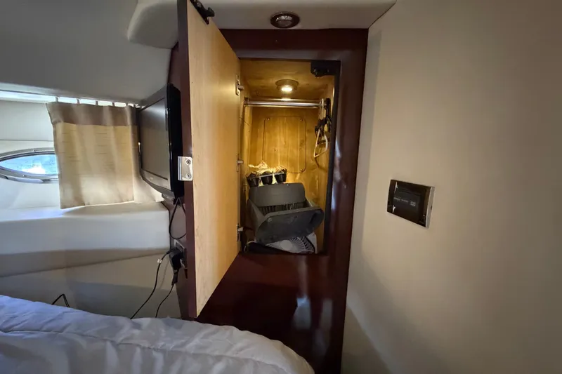 Slide: The Image of Interior view of 2010 Sea Ray 390 Sedan Bridge cabin with open closet. - 107