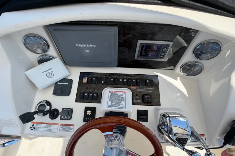 Slide: The Image of Control panel of 2010 Sea Ray 390 Sedan Bridge with Raymarine navigation system. - 39