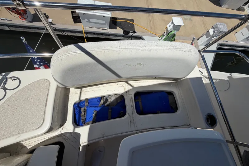 Slide: The Image of 2010 Sea Ray 390 Sedan Bridge boat deck with storage compartments and life preserver. - 46
