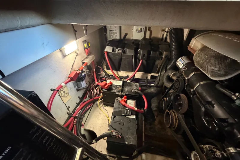 Slide: The Image of Engine room of 2010 Sea Ray 390 Sedan Bridge with batteries and wiring. - 137