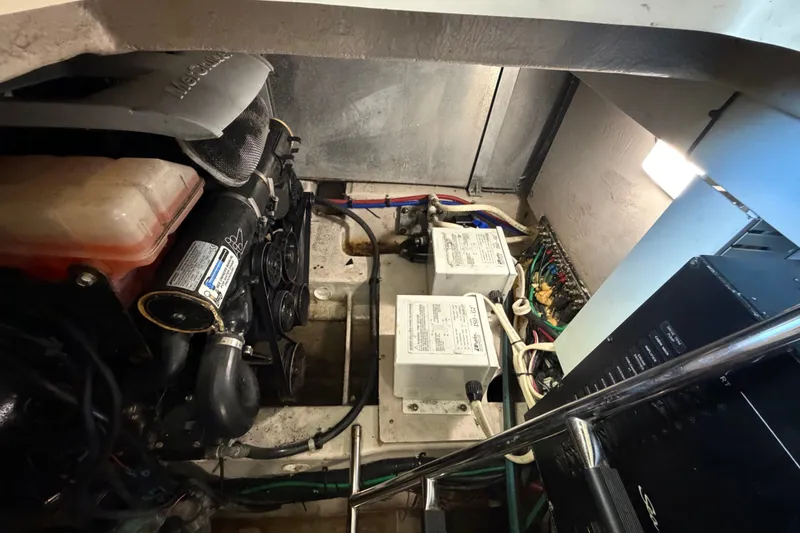 Slide: The Image of Engine room of 2010 Sea Ray 390 Sedan Bridge, showcasing mechanical components and wiring. - 138