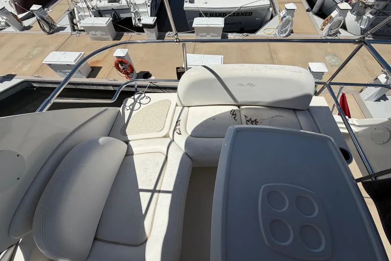 Slide: The Image of Flybridge seating area on a 2010 Sea Ray 390 Sedan Bridge yacht at a marina. - 35