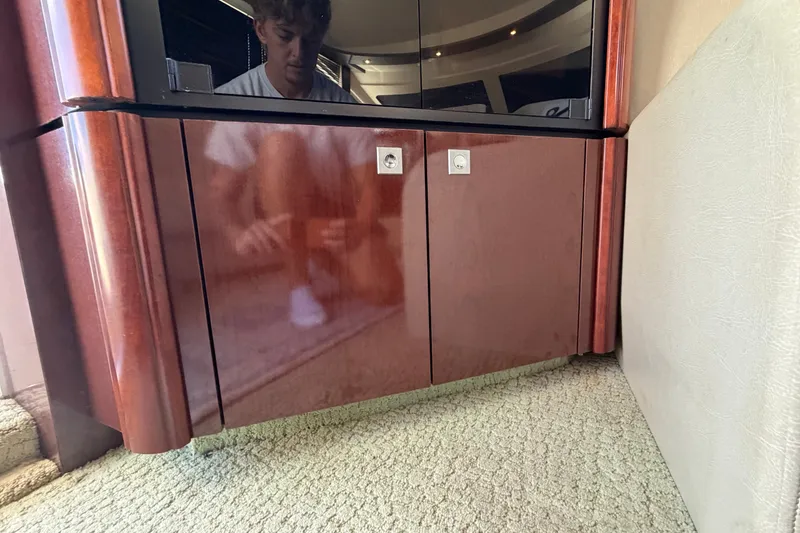 Slide: The Image of Interior of 2010 Sea Ray 390 Sedan Bridge with polished wood cabinetry. - 86