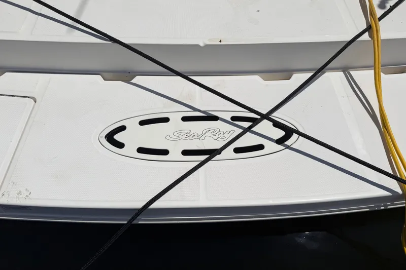 Slide: The Image of 2010 Sea Ray 390 Sedan Bridge swim platform with logo and mooring lines. - 19