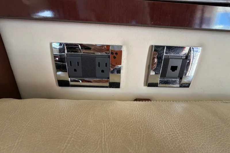 Slide: The Image of Power and network outlets on 2010 Sea Ray 390 Sedan Bridge yacht interior. - 92